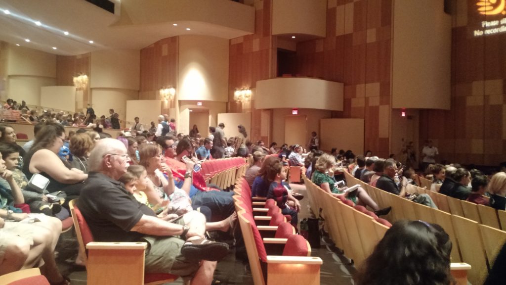 Crowd getting to their seats before the performance.
